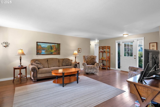 1588 20th St, Florence, OR 97439 - living area featuring wood finished floors and baseboards