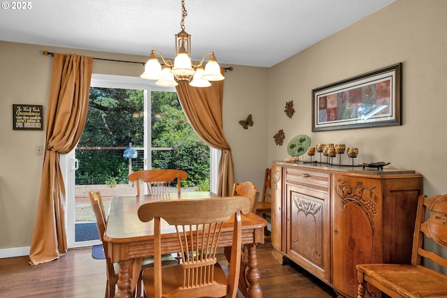 1588 20th St, Florence, OR 97439 - dining area with a chandelier and dark wood-type flooring