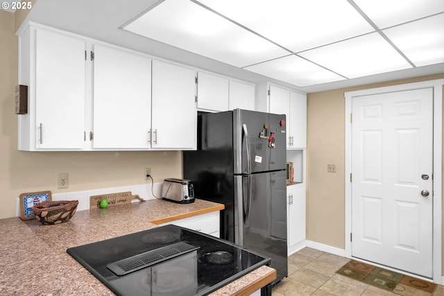 1588 20th St, Florence, OR 97439 - kitchen with white cabinetry and freestanding refrigerator