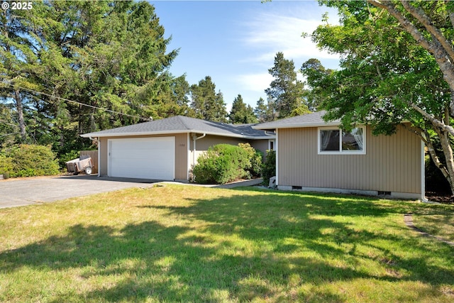 1588 20th St, Florence, OR 97439 - ranch-style house featuring asphalt driveway, a garage, and a front yard