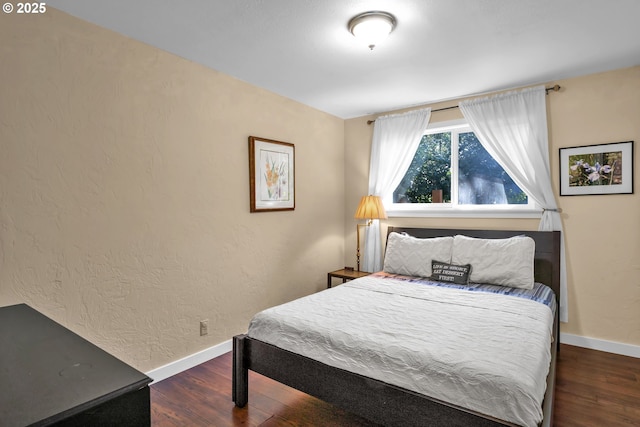 1588 20th St, Florence, OR 97439 - bedroom featuring wood finished floors and baseboards