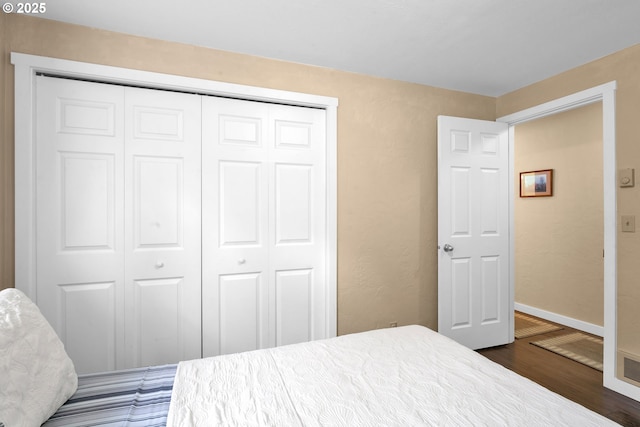 1588 20th St, Florence, OR 97439 - bedroom with dark wood-style floors and a closet