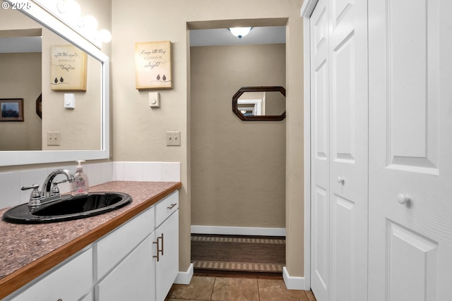 1588 20th St, Florence, OR 97439 - bathroom featuring a closet, vanity, and tile patterned floors