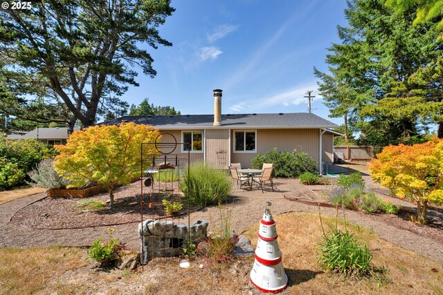 1588 20th St, Florence, OR 97439 - back of property with a patio area