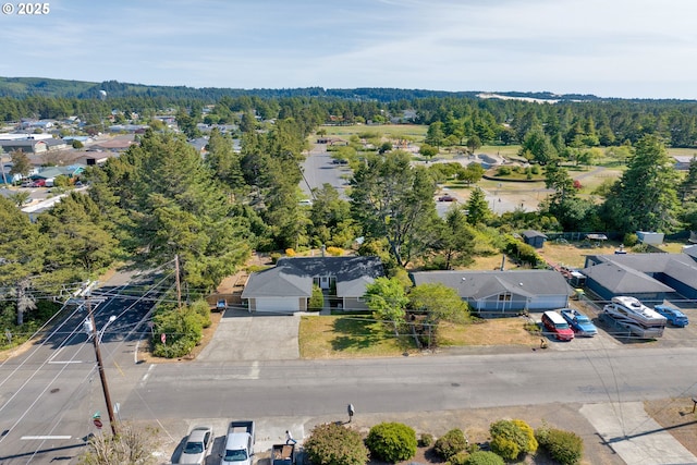 1588 20th St, Florence, OR 97439 - aerial view of residential area featuring a heavily wooded area
