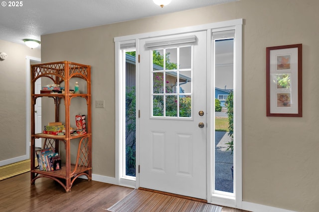 1588 20th St, Florence, OR 97439 - entrance foyer with wood finished floors and baseboards