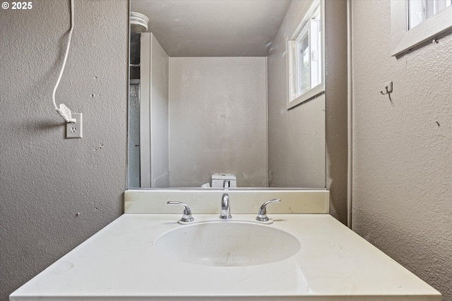 254 Humphrey Addition Rd, Glendale, OR 97442 - bathroom featuring a textured wall and vanity