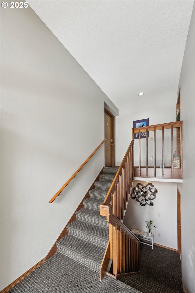 stairs with recessed lighting, baseboards, and carpet flooring