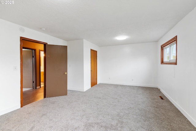 10525 SE Mitchell St, Portland, OR 97266 - carpeted spare room with baseboards, a textured ceiling, and a smoke detector