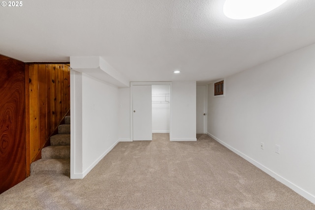 10525 SE Mitchell St, Portland, OR 97266 - finished basement featuring light colored carpet, stairway, baseboards, and recessed lighting