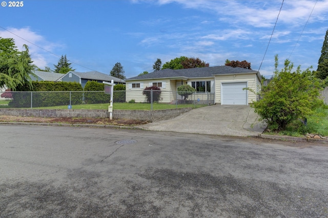 10525 SE Mitchell St, Portland, OR 97266 - ranch-style home with a fenced front yard, driveway, and an attached garage