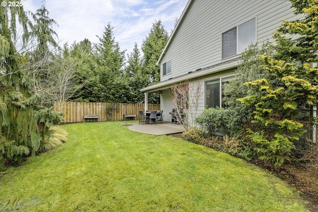 view of yard with fence and a patio area