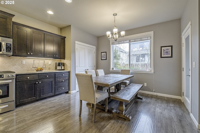 dining area featuring recessed lighting, baseboards, light wood-style floors, and a chandelier