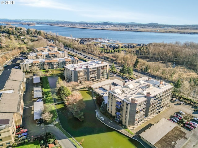 birds eye view of property with a water view