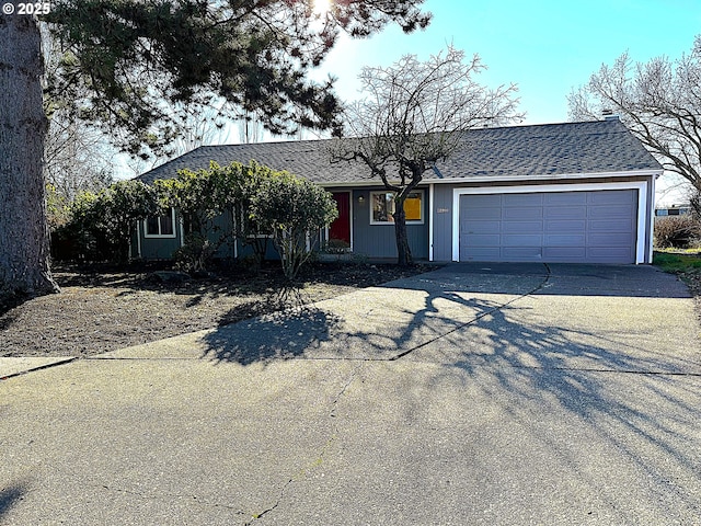 ranch-style house featuring a garage