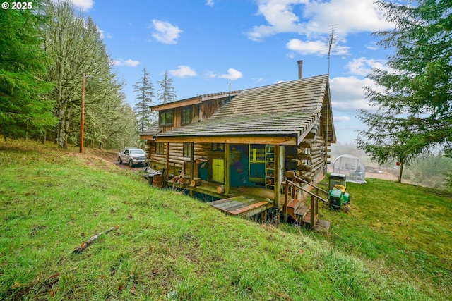 31975 Berlin Rd, Lebanon, OR 97355 - back of house featuring log siding, a yard, and an outbuilding