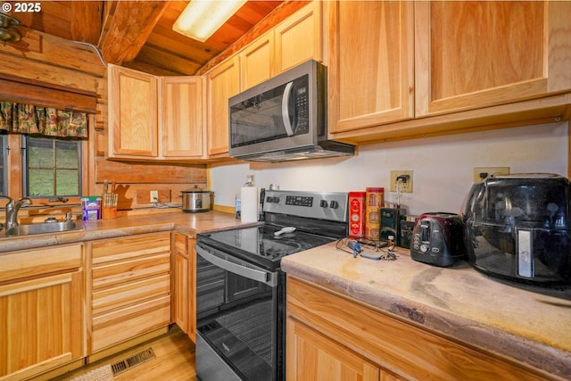 31975 Berlin Rd, Lebanon, OR 97355 - kitchen featuring visible vents, light brown cabinets, a sink, appliances with stainless steel finishes, and light countertops