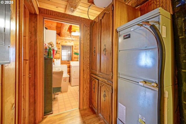 31975 Berlin Rd, Lebanon, OR 97355 - hall featuring beam ceiling, independent washer and dryer, log walls, light floors, and wood ceiling