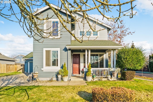 view of front of house featuring a porch and a front lawn