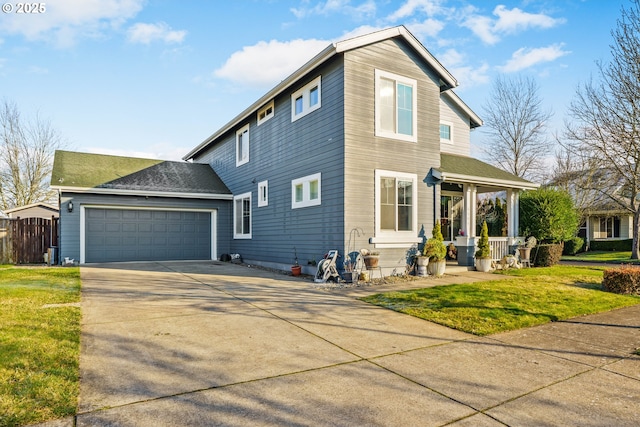 view of property exterior featuring a porch, a garage, and a yard