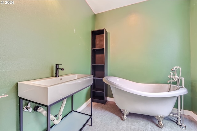 9116 N Willamette Blvd, Portland, OR 97203 - bathroom featuring a freestanding tub and baseboards