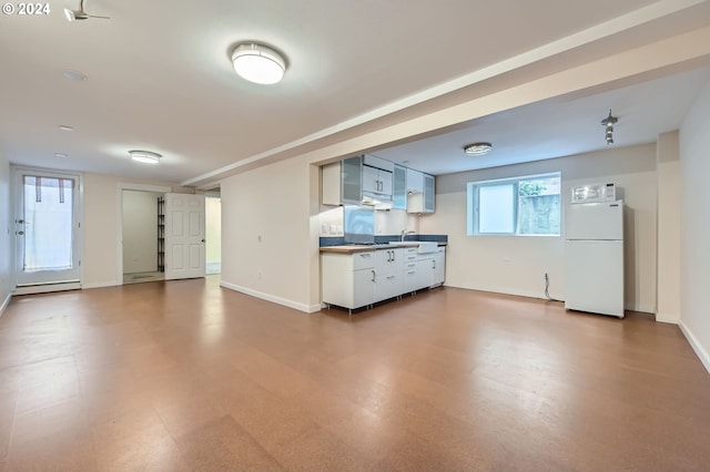 9116 N Willamette Blvd, Portland, OR 97203 - unfurnished living room featuring baseboard heating and dark flooring