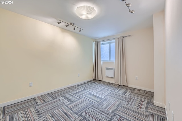 9116 N Willamette Blvd, Portland, OR 97203 - unfurnished room featuring track lighting, carpet, and a wall unit AC