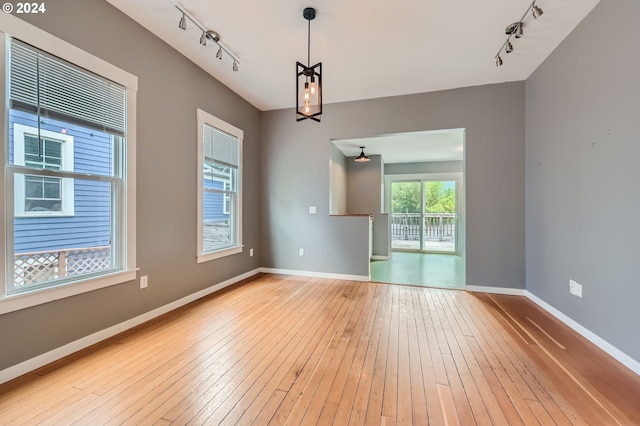 9116 N Willamette Blvd, Portland, OR 97203 - spare room with track lighting and wood-type flooring