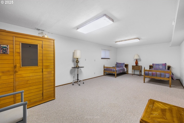 carpeted bedroom featuring baseboards