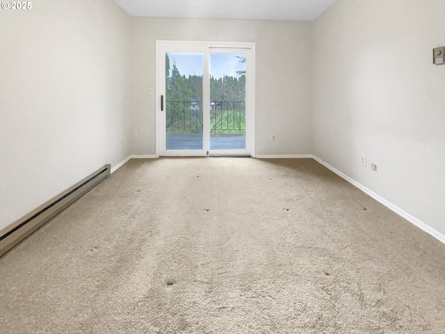 carpeted empty room with baseboard heating