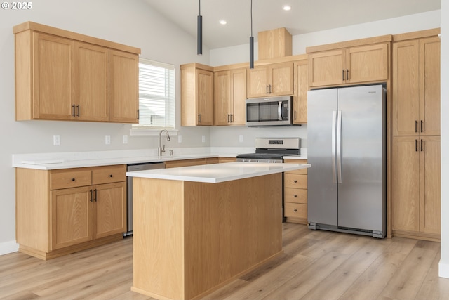 3237 Wildflower Dr, Springfield, OR 97478 - kitchen with appliances with stainless steel finishes, light wood-type flooring, recessed lighting, a kitchen island, and light countertops