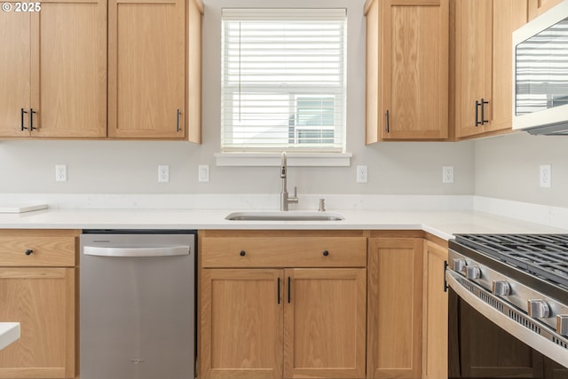 3237 Wildflower Dr, Springfield, OR 97478 - kitchen featuring stainless steel appliances, light countertops, and light brown cabinets