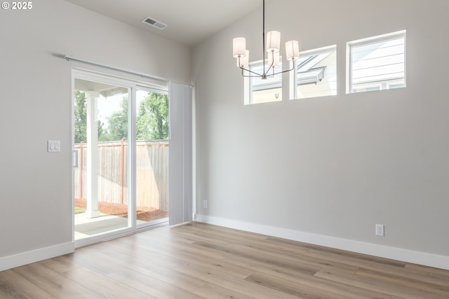 3237 Wildflower Dr, Springfield, OR 97478 - unfurnished room with a chandelier and wood finished floors