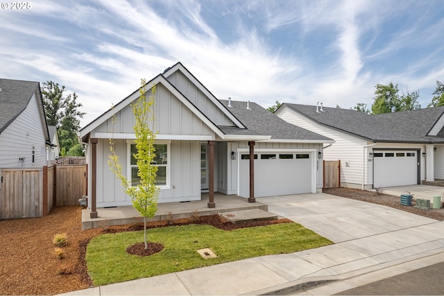 3237 Wildflower Dr, Springfield, OR 97478 - modern inspired farmhouse with a porch, board and batten siding, a garage, and concrete driveway