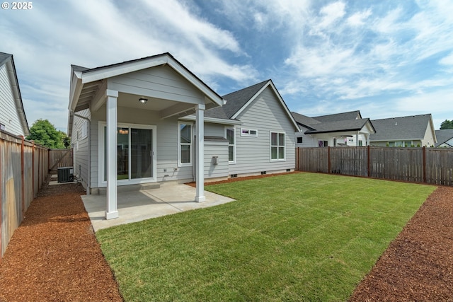 3237 Wildflower Dr, Springfield, OR 97478 - rear view of house with a fenced backyard, a patio, a shingled roof, and crawl space