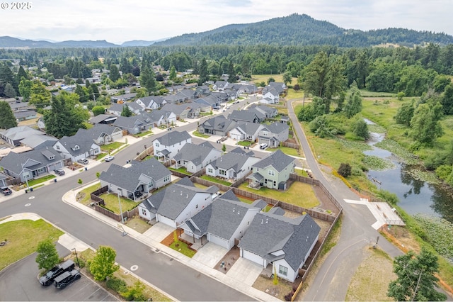 3237 Wildflower Dr, Springfield, OR 97478 - aerial perspective of suburban area with a heavily wooded area and a water and mountain view