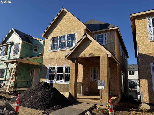 tudor-style house featuring a front yard