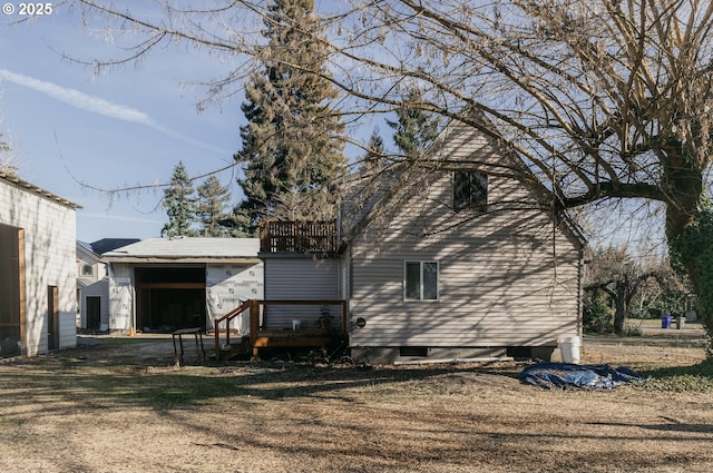 rear view of house with a balcony