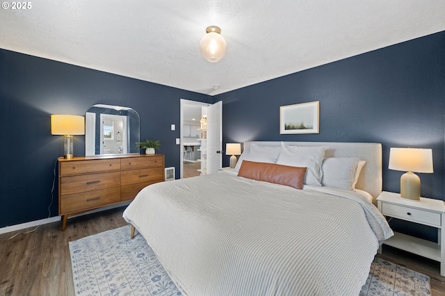 bedroom featuring dark hardwood / wood-style flooring