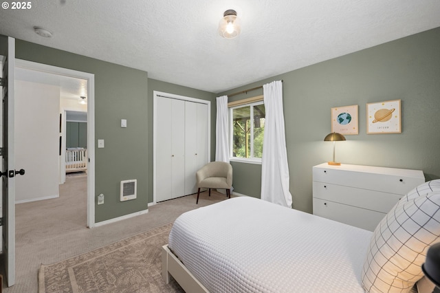 carpeted bedroom with radiator, a closet, heating unit, and a textured ceiling