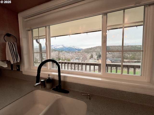 interior details featuring a sink and a mountain view
