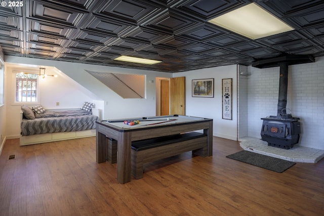 rec room with visible vents, wood finished floors, and an ornate ceiling