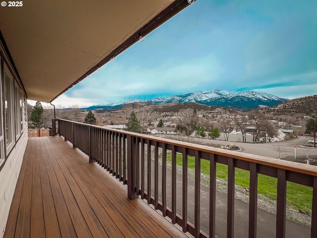 wooden deck with a mountain view