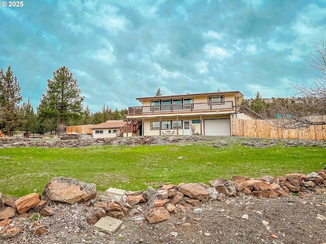 537 NW Charolais Hts, John Day, OR 97845 - rear view of house featuring stairs, a wooden deck, and an attached garage