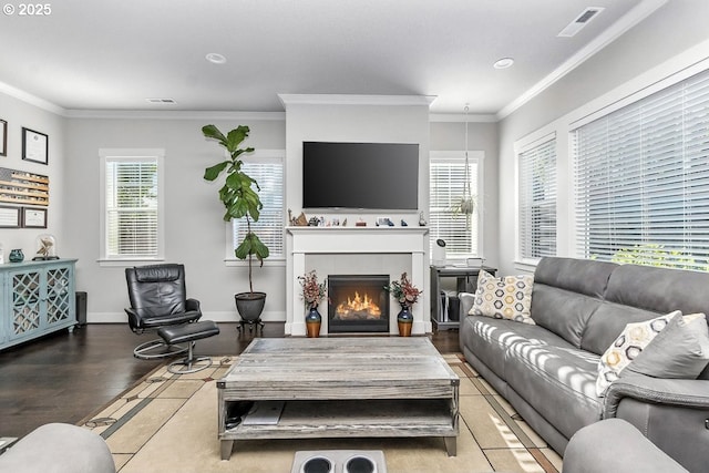 16949 SW Appledale Rd, Beaverton, OR 97007 - living area featuring ornamental molding, a tile fireplace, wood finished floors, and recessed lighting