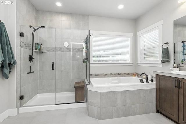 16949 SW Appledale Rd, Beaverton, OR 97007 - bathroom with vanity, a bath, tile patterned flooring, a stall shower, and recessed lighting