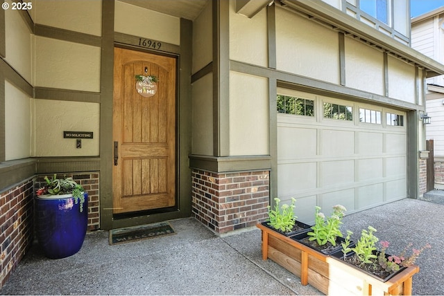 16949 SW Appledale Rd, Beaverton, OR 97007 - property entrance featuring brick siding and an attached garage