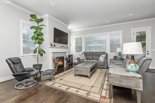 16949 SW Appledale Rd, Beaverton, OR 97007 - living area featuring wood finished floors, ornamental molding, recessed lighting, and a warm lit fireplace