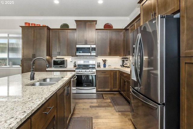 16949 SW Appledale Rd, Beaverton, OR 97007 - kitchen with stainless steel appliances, ornamental molding, dark wood-style flooring, recessed lighting, and decorative backsplash