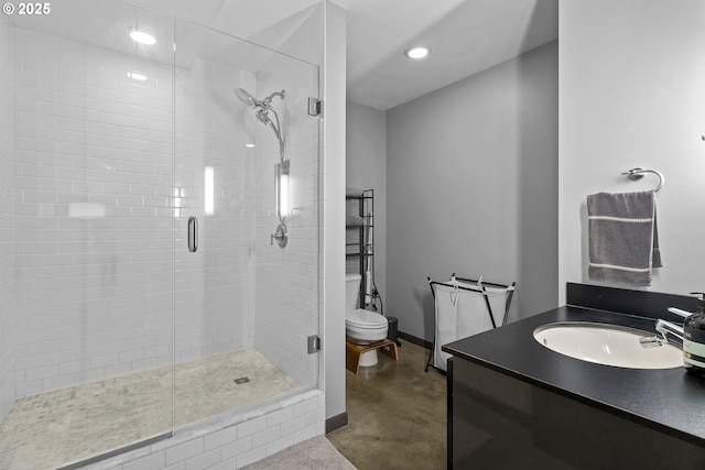 bathroom with vanity, toilet, a shower with door, and concrete floors